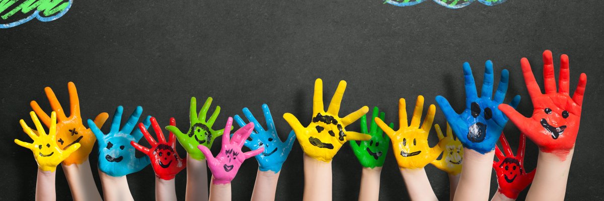 Colorful,Hands,In,Front,Of,A,Chalkboard,With,Clouds