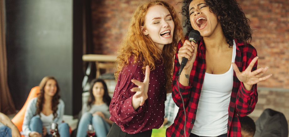 Happy,Friends,Singing,Together,At,Home.,Karaoke,Party,Concept