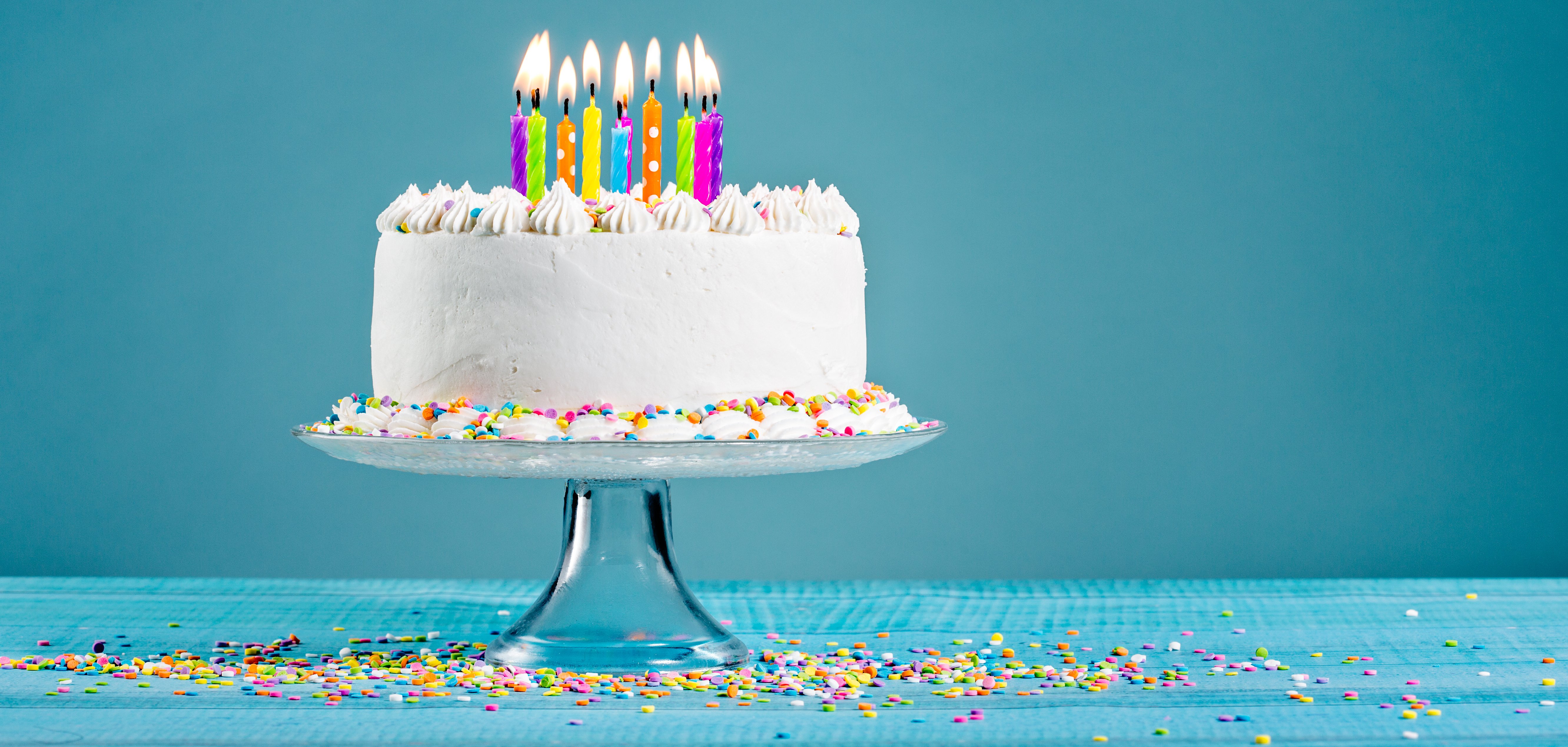White,Birthday,Cake,Over,Blue,Background