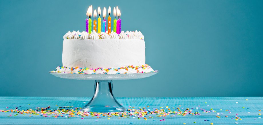 White,Birthday,Cake,Over,Blue,Background