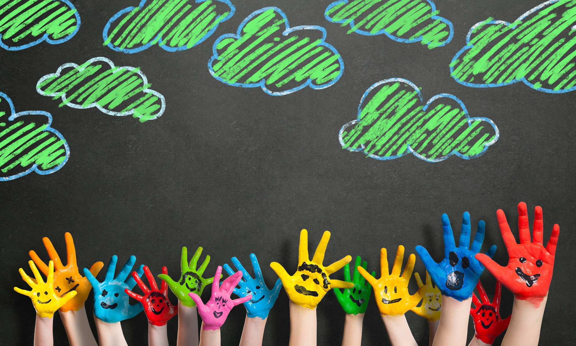 Colorful,Hands,In,Front,Of,A,Chalkboard,With,Clouds Colorful,Hands,In,Front,Of,A,Chalkboard,With,Clouds