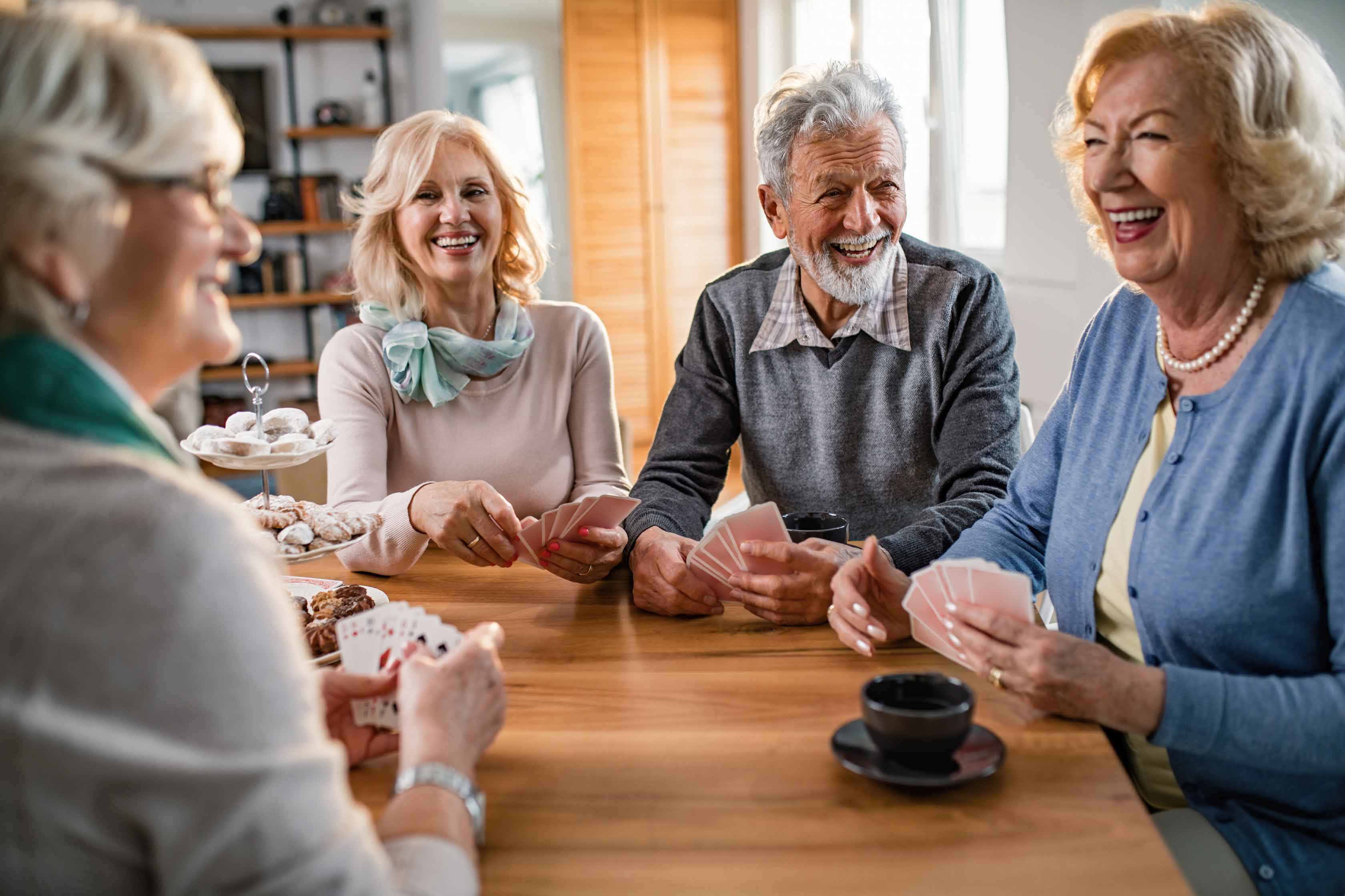 Group,Of,Cheerful,Mature,People,Having,Fun,While,Playing,Cards