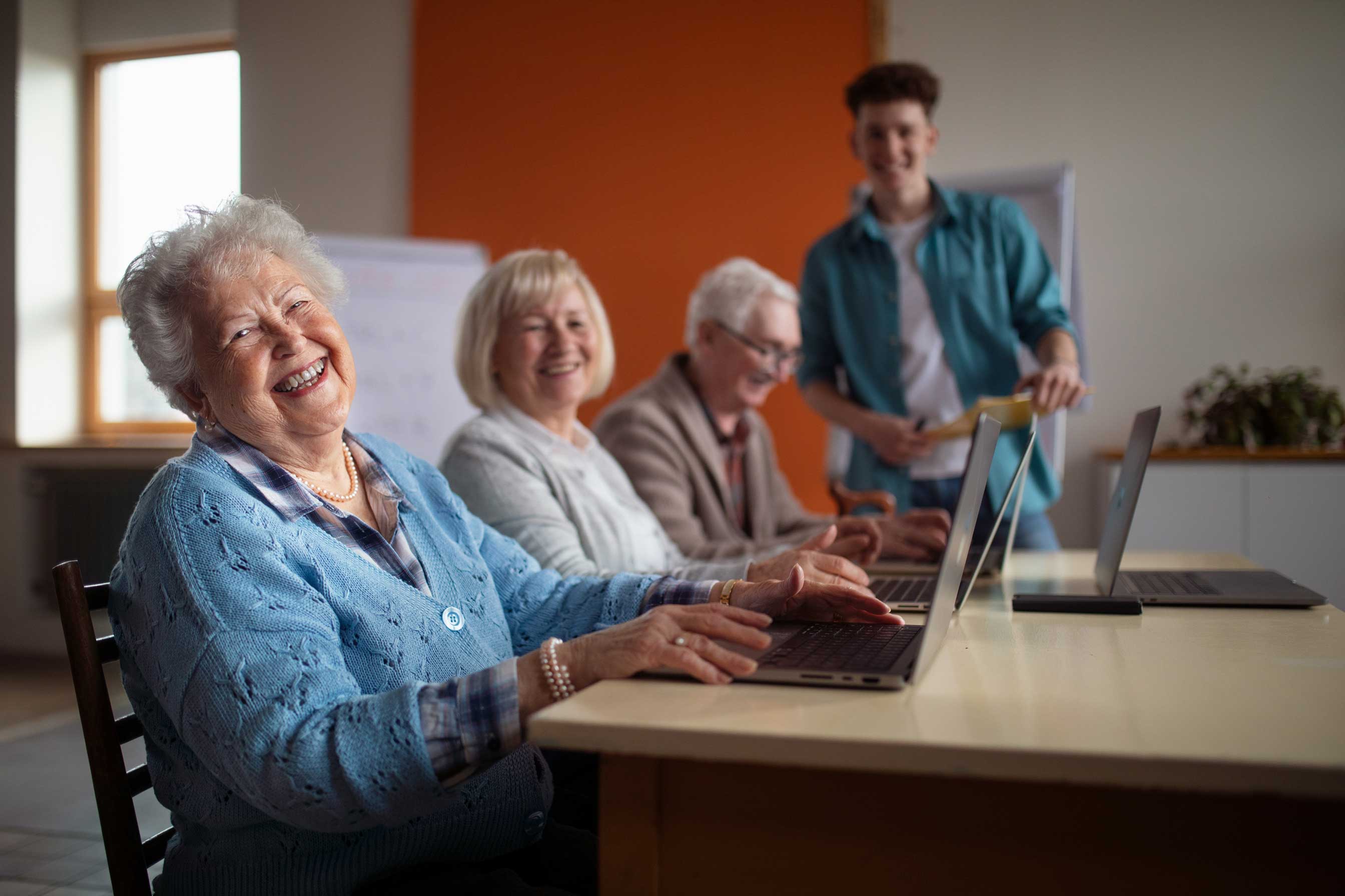 Senior,Group,In,Retirement,Home,With,Young,Instructor,Learning,Together Senior,Group,In,Retirement,Home,With,Young,Instructor,Learning,Together