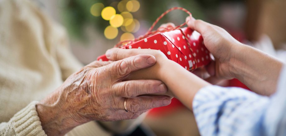 Close-up,Of,Hands,Of,Senior,And,Young,Woman,Holding,A